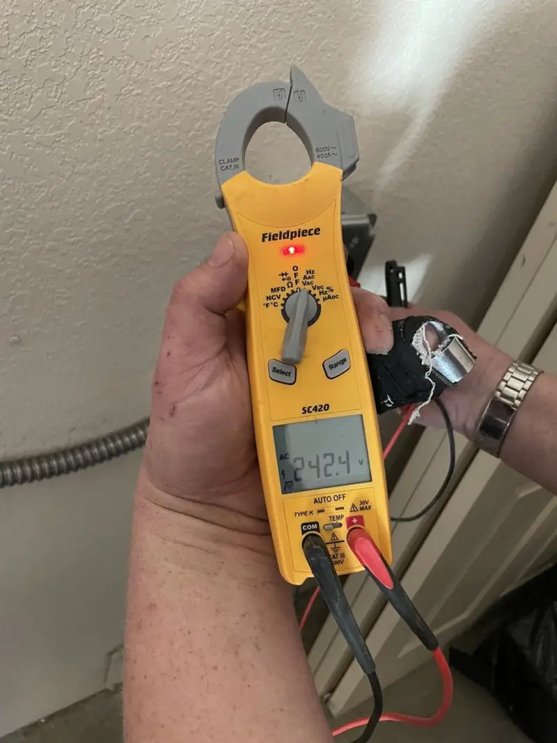 Voltage testing with clamp meter during Hot Tub / Pool Electrical Wiring in Holland
